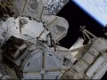 Spacewalking astronauts tackle more solar panel advance work